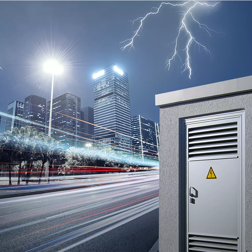 Electric vehicle charging station and power cabinet in an urban setting at night, with lightning over a city skyline.