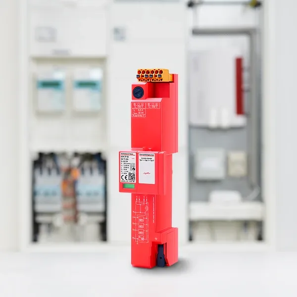 Im Vordergrund ist ein rotes elektronisches Gerät mit verschiedenen Anschlüssen zu sehen, im Hintergrund sind unscharfe elektrische Komponenten zu sehen.