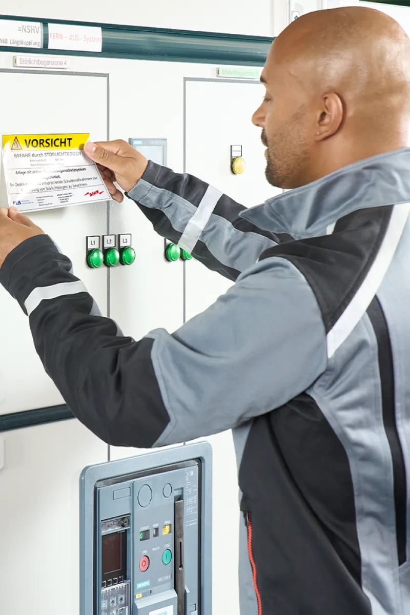 electrician applying stickers